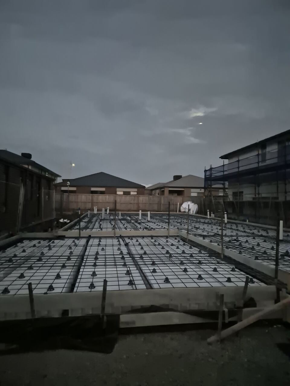 Steel reinforcement and waffle pods laid out on the Jagged Circuit block before the slab pour