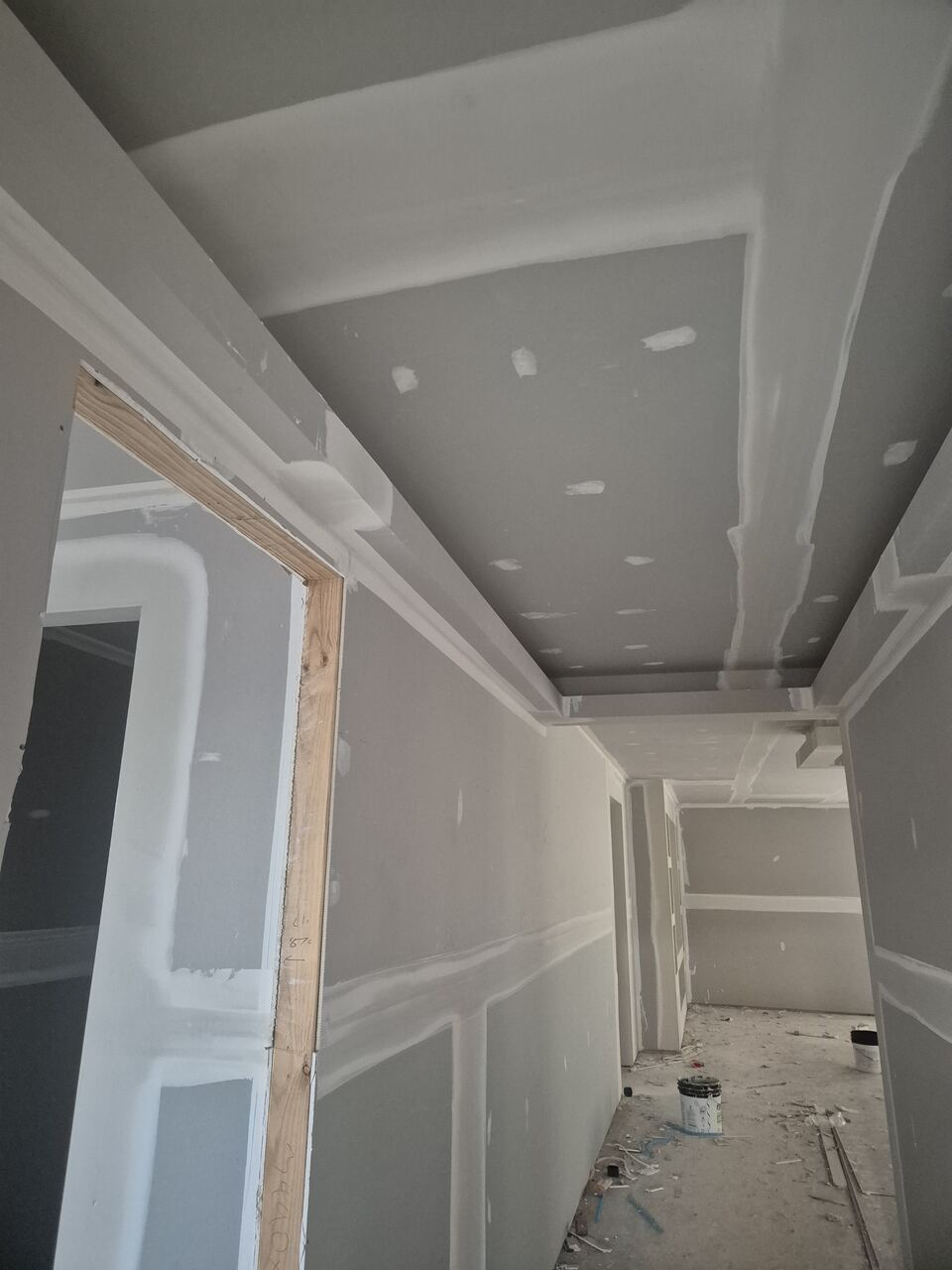 Hallway at Ladhams Way with plasterboard hung and set, ready for cornices and paint